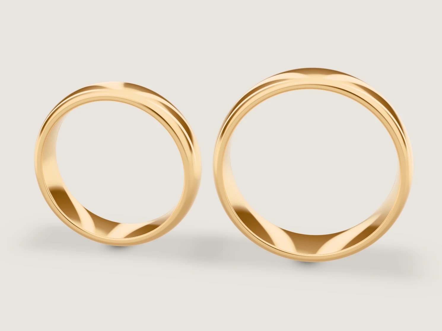 Ringgestalter im Paar-Modus: zwei Trauringe in Gelbgold, live in 3D gerendert